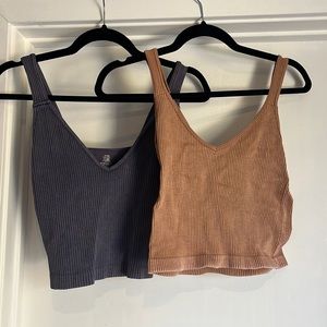 Pair of ribbed crop tanks.